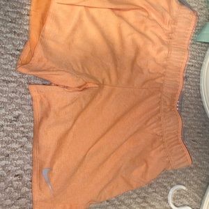 nike neon orange women shorts. size medium